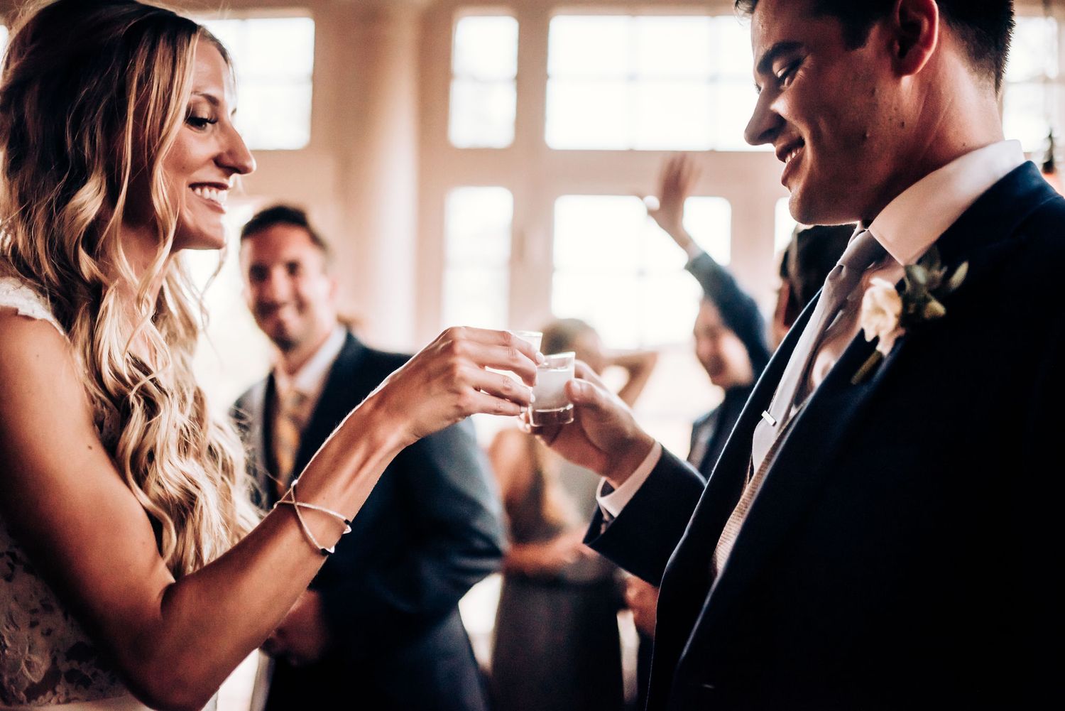 A couple exchanges rings during an intimate wedding ceremony moment.