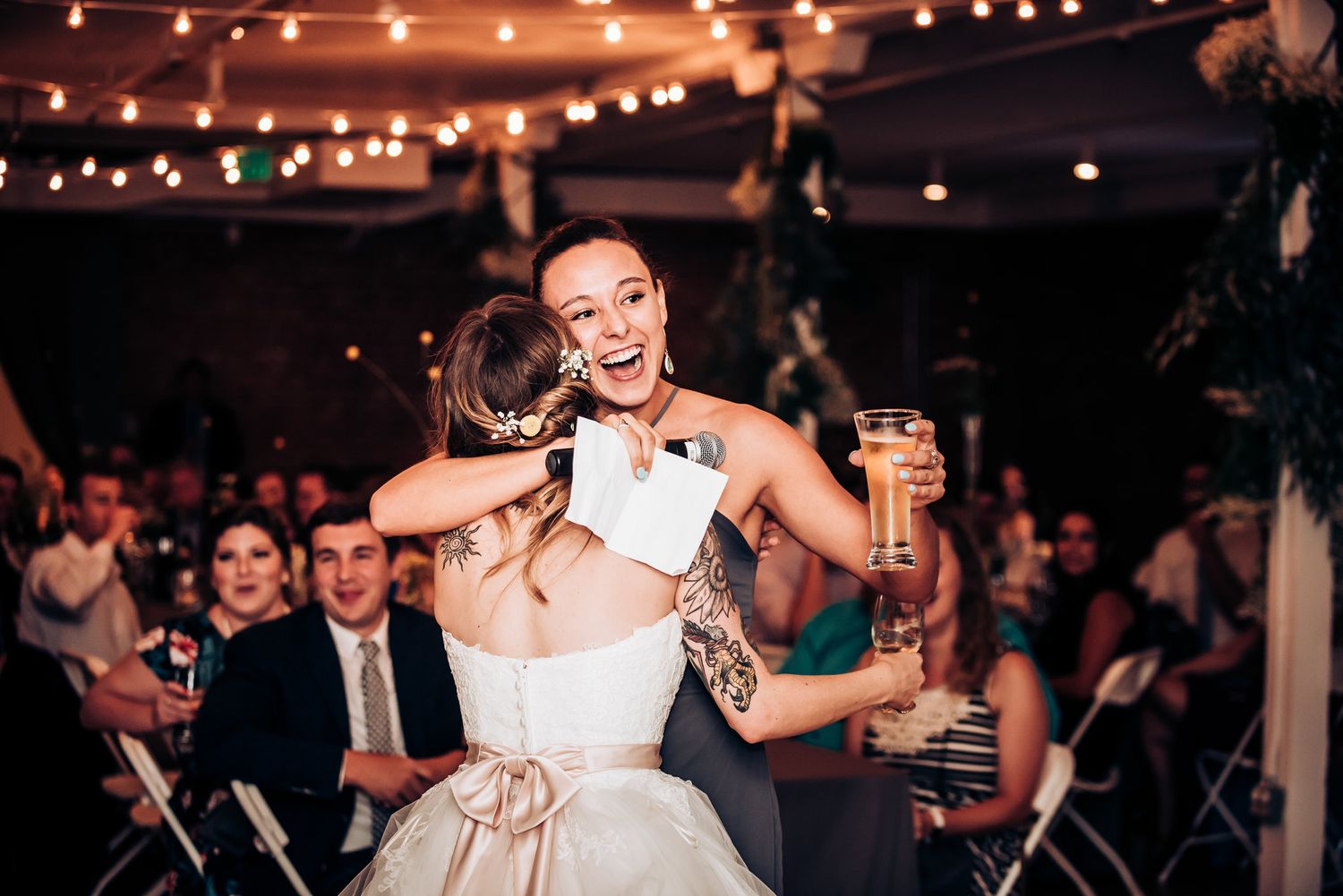 Couple celebrates joyfully on the dance floor during their wedding reception.