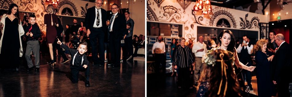 Wedding guests celebrating and dancing in an elegantly decorated venue.