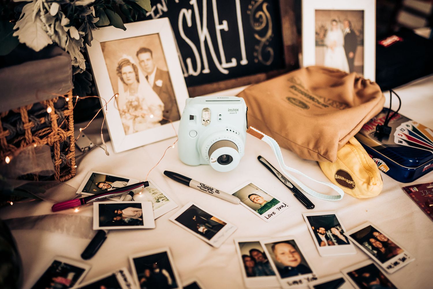 Vintage-style photography setup with instant camera, polaroids, and nostalgic memorabilia.