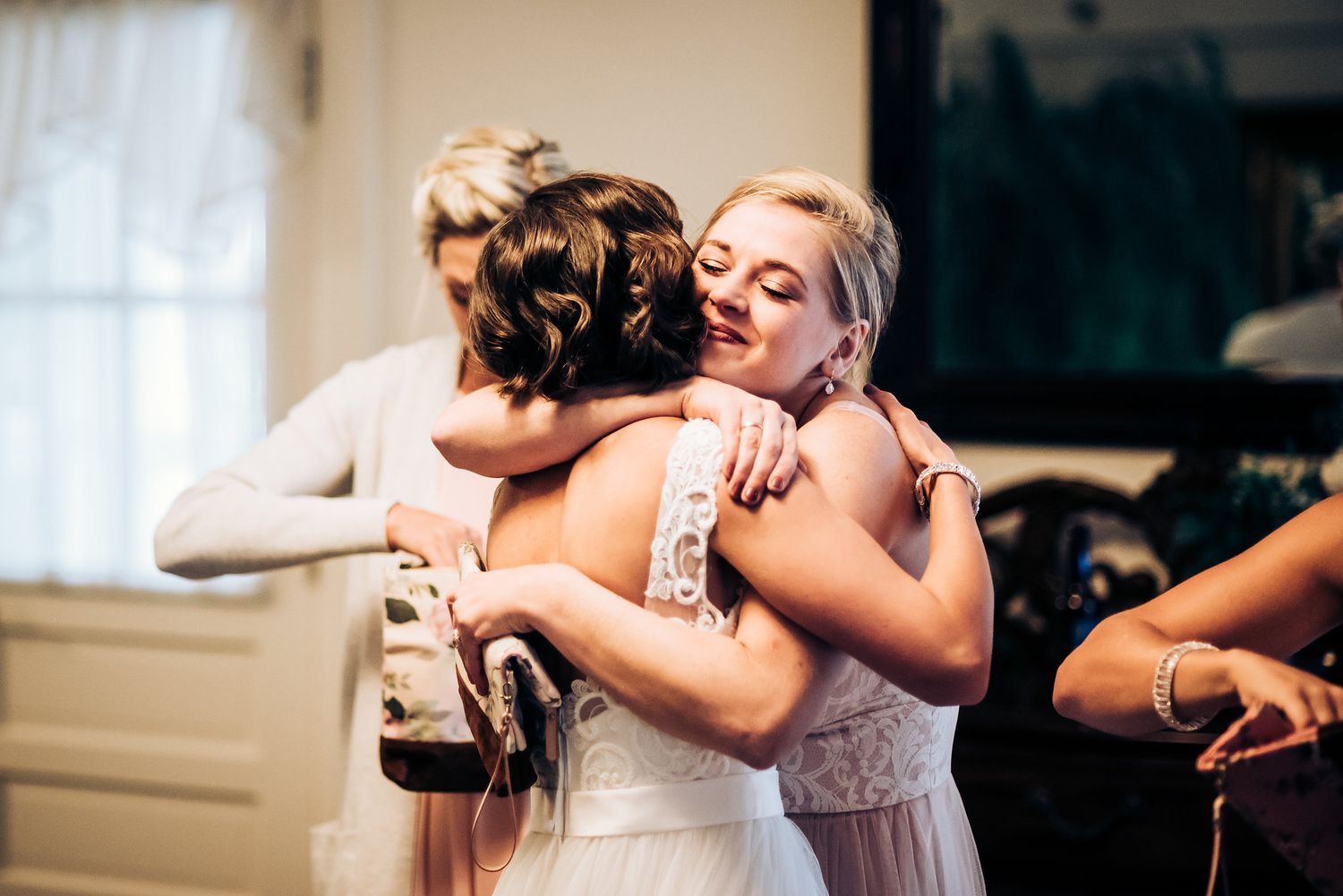 Emotional embraces shared during wedding celebrations.
