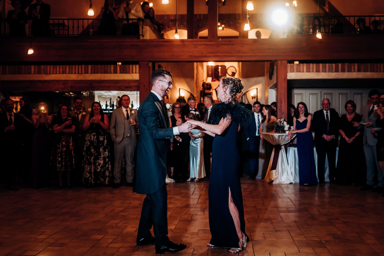 A special dance performance during wedding reception with guests gathered in a circle.