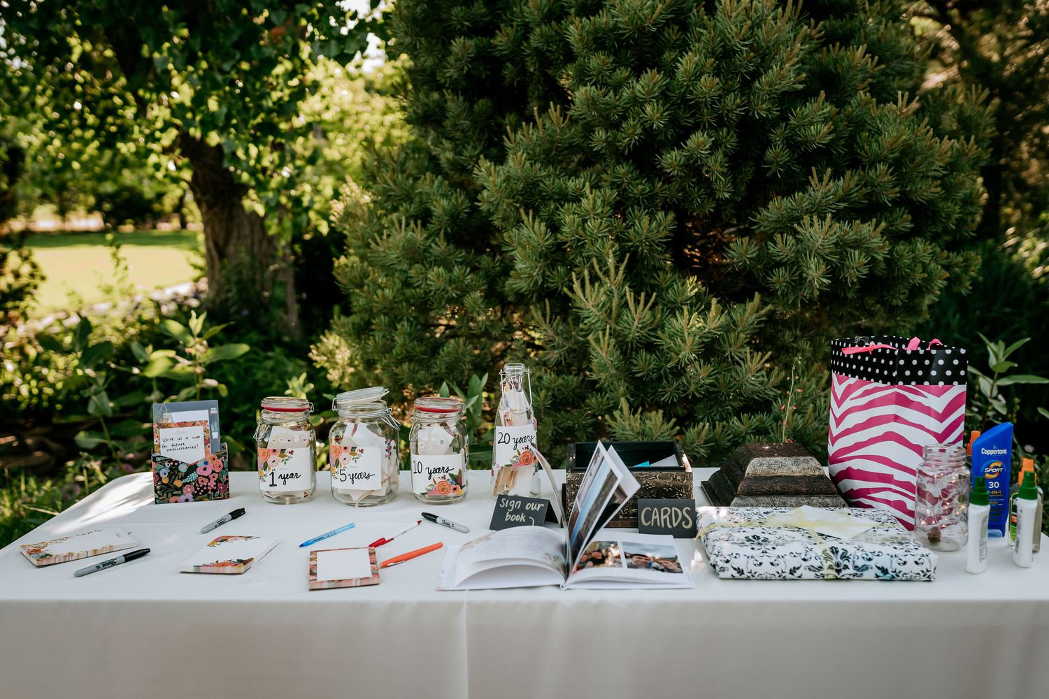 Wedding reception table set up with mason jars and American flag decorations.