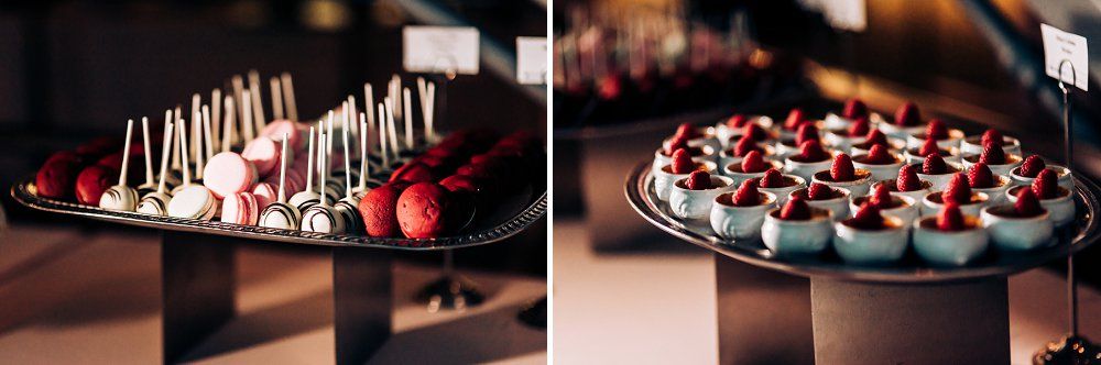 Elegant dessert platter featuring chocolate covered strawberries on a dark display.