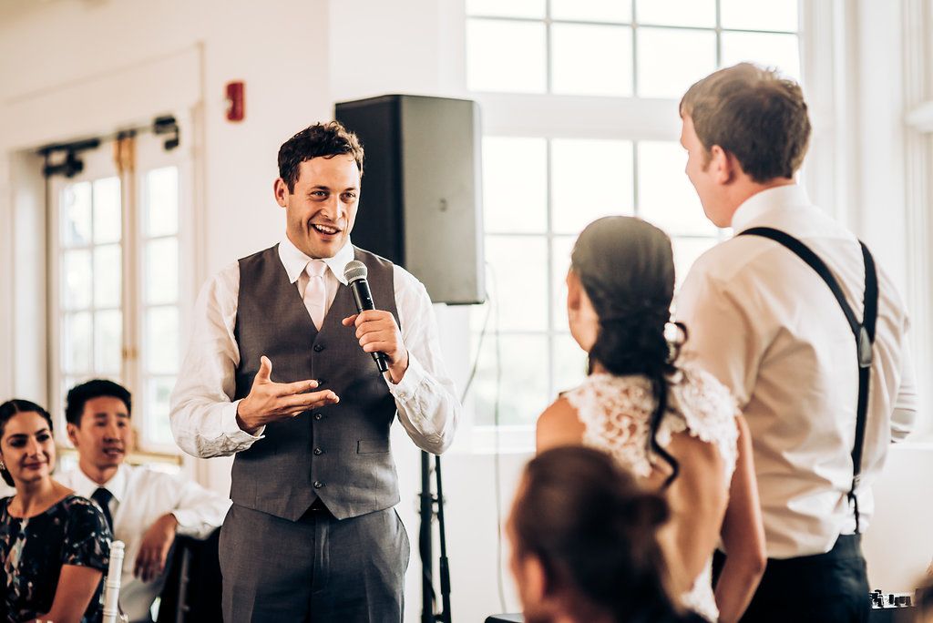 Wedding speech being delivered during reception celebration.