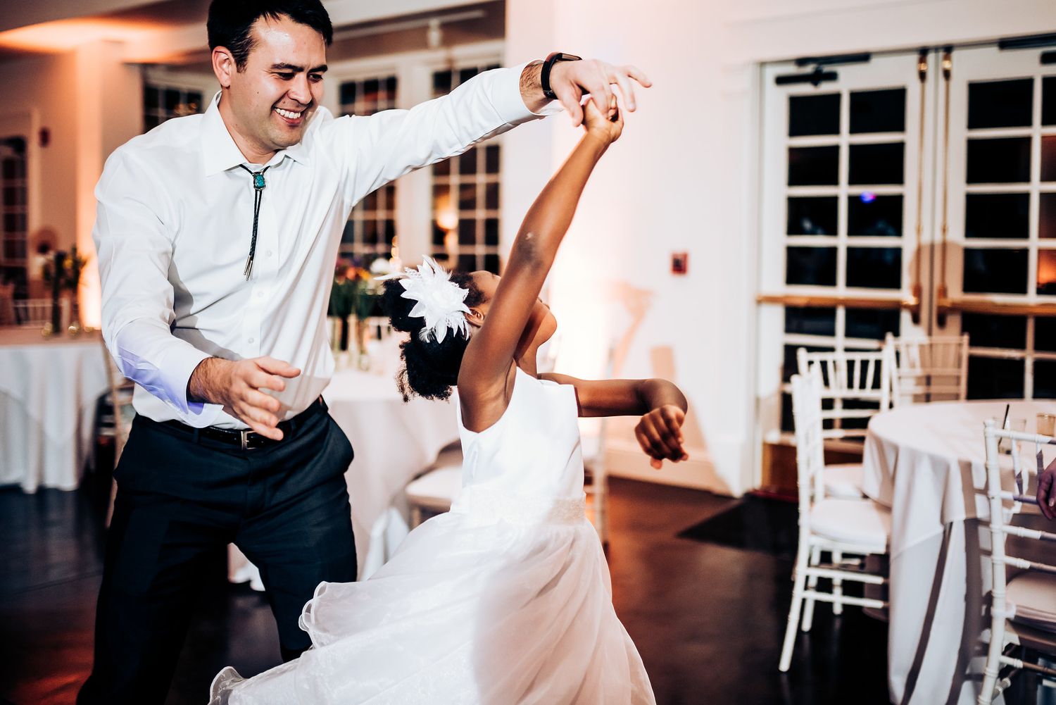 Dancers show off their moves on the wedding reception dance floor.