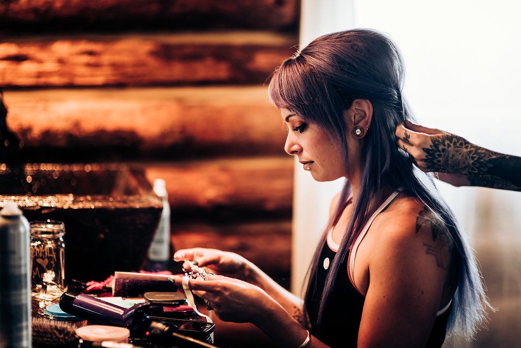 Interior scene of vintage-style preparations at wooden table with rustic decor.