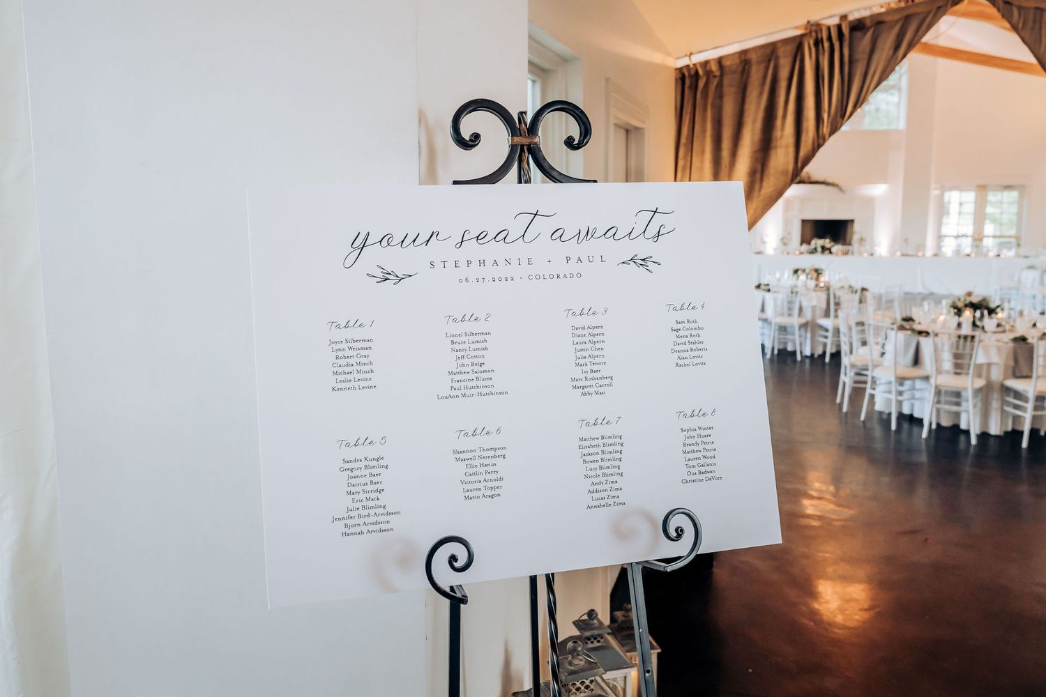 Behind-the-scenes view of wedding preparations through sheer curtains.