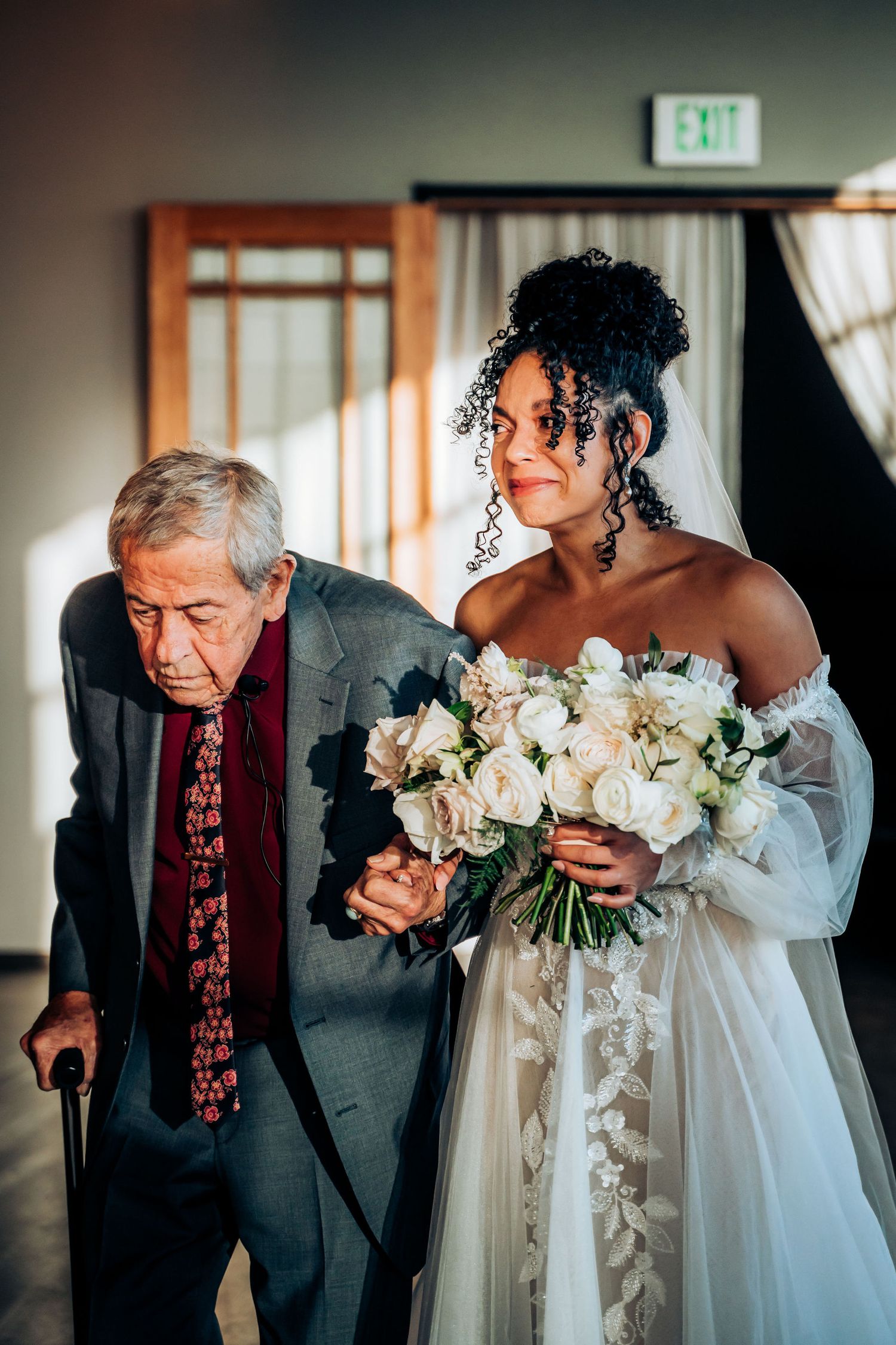 Beautiful bridal portrait with white floral bouquet in natural window light.