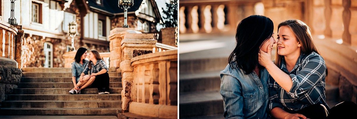A couple sits together on ornate stone steps in front of a historic building.