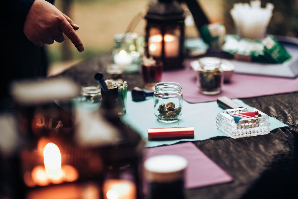 Atmospheric table setting with lit candles and lanterns creating a romantic ambiance.