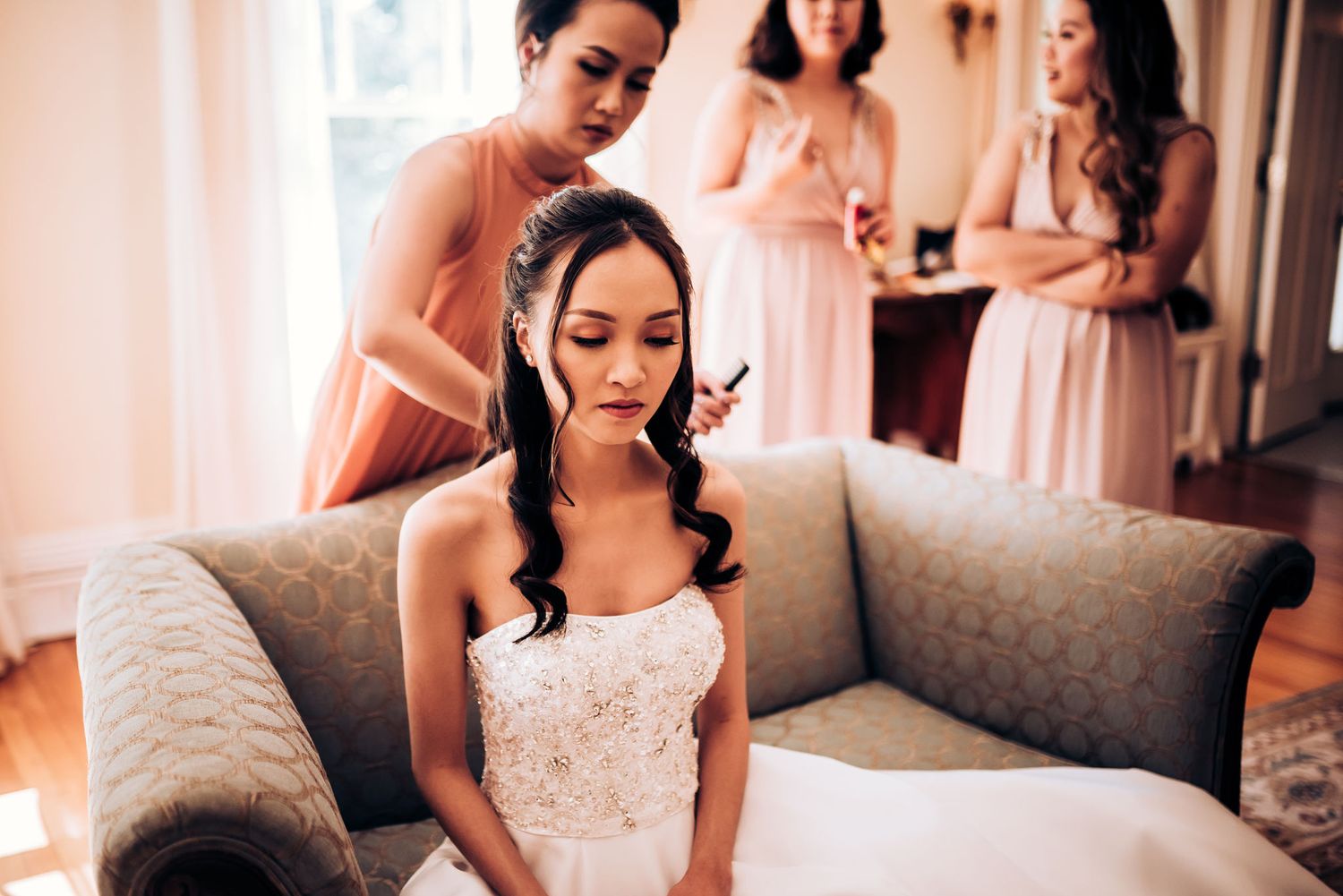 Final wedding preparations in a cozy living room with soft natural light.