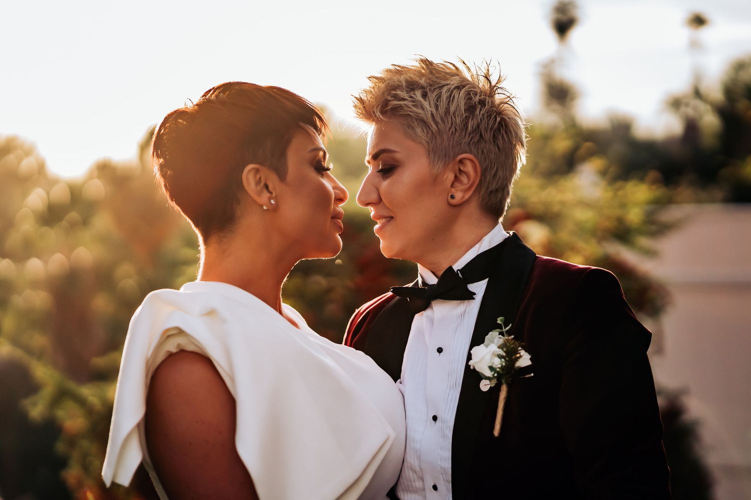 Intimate sunset portraits of couple in formal wedding attire.