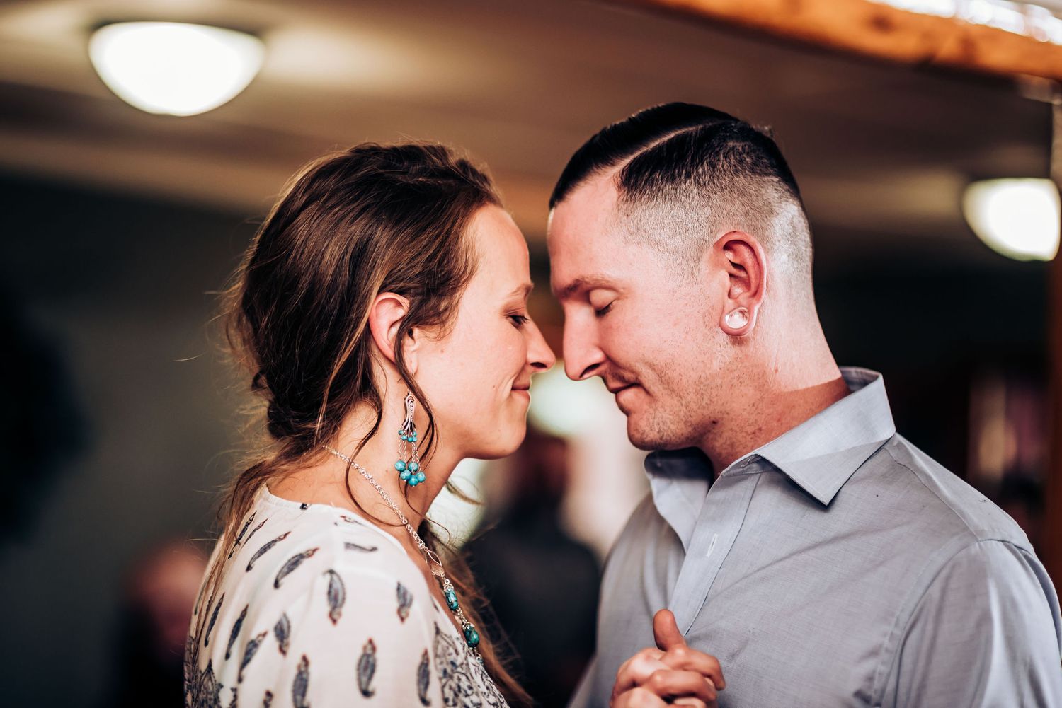 An intimate moment shared between a couple during their wedding celebration.