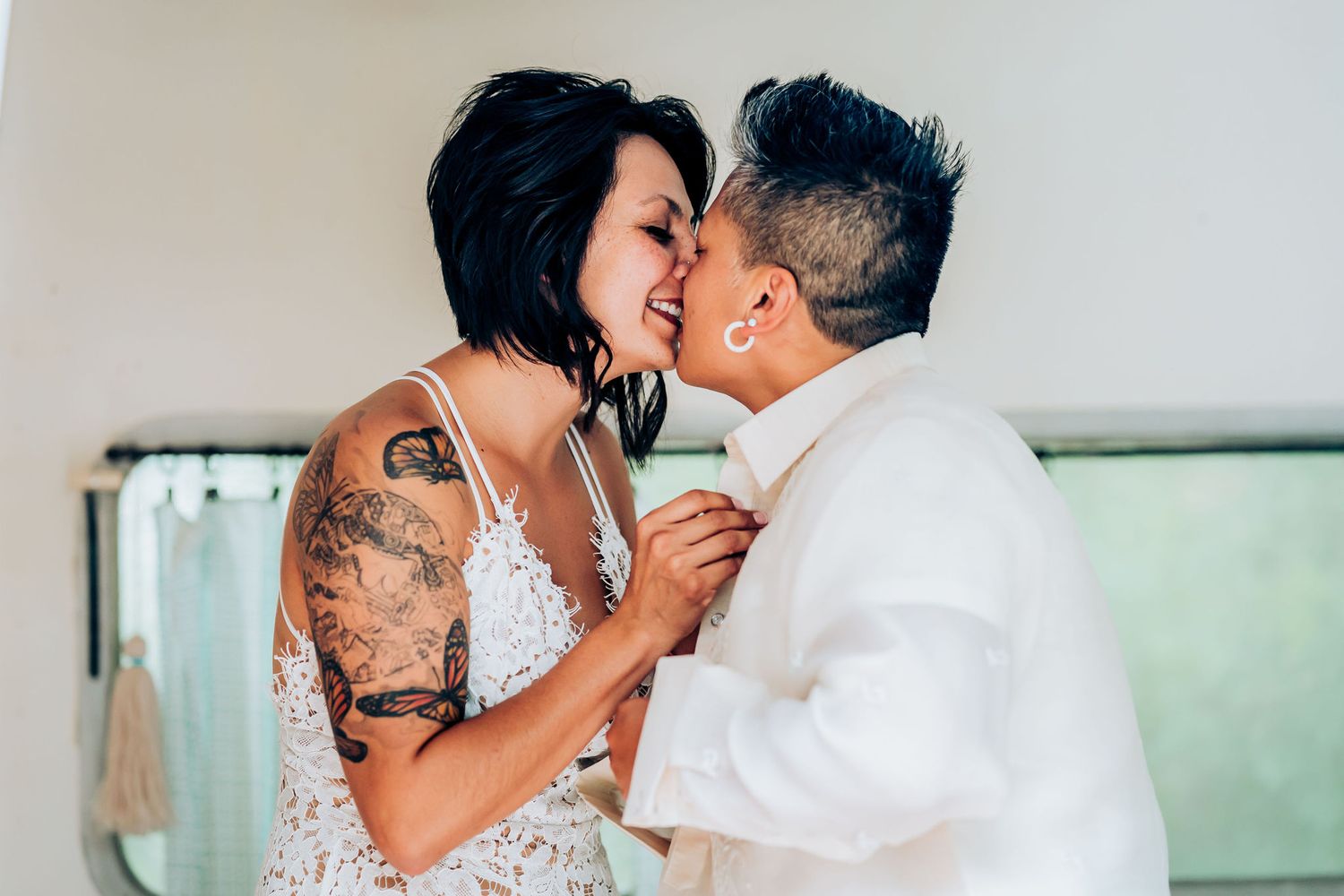 tender moment shared between couple in wedding attire.