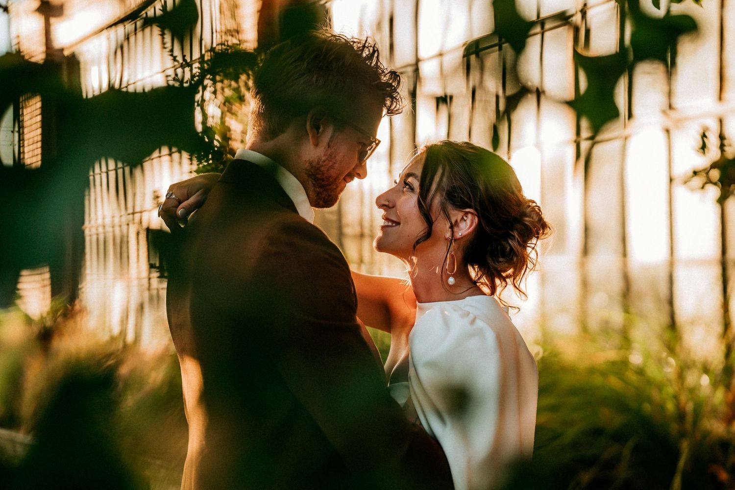 A romantic sunset portrait with golden light filtering through leaves.