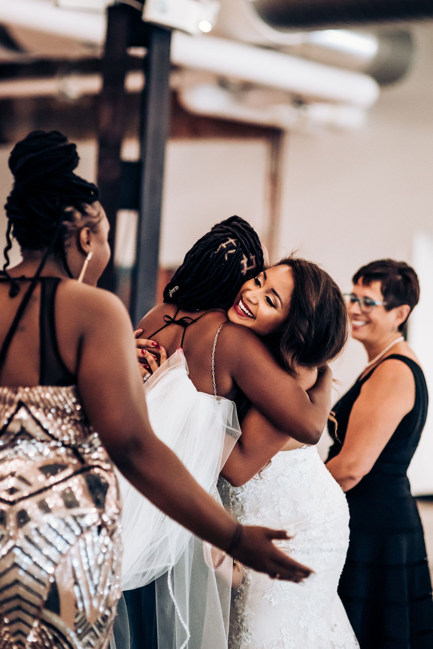 Emotional embrace shared during wedding preparations.