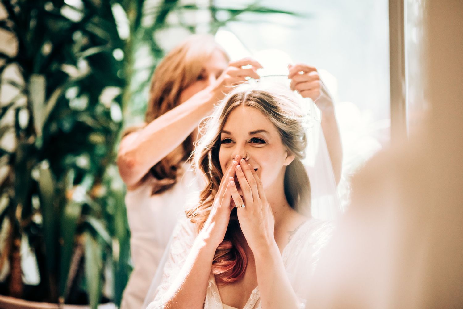 Joyful moment captured in bright natural window light.
