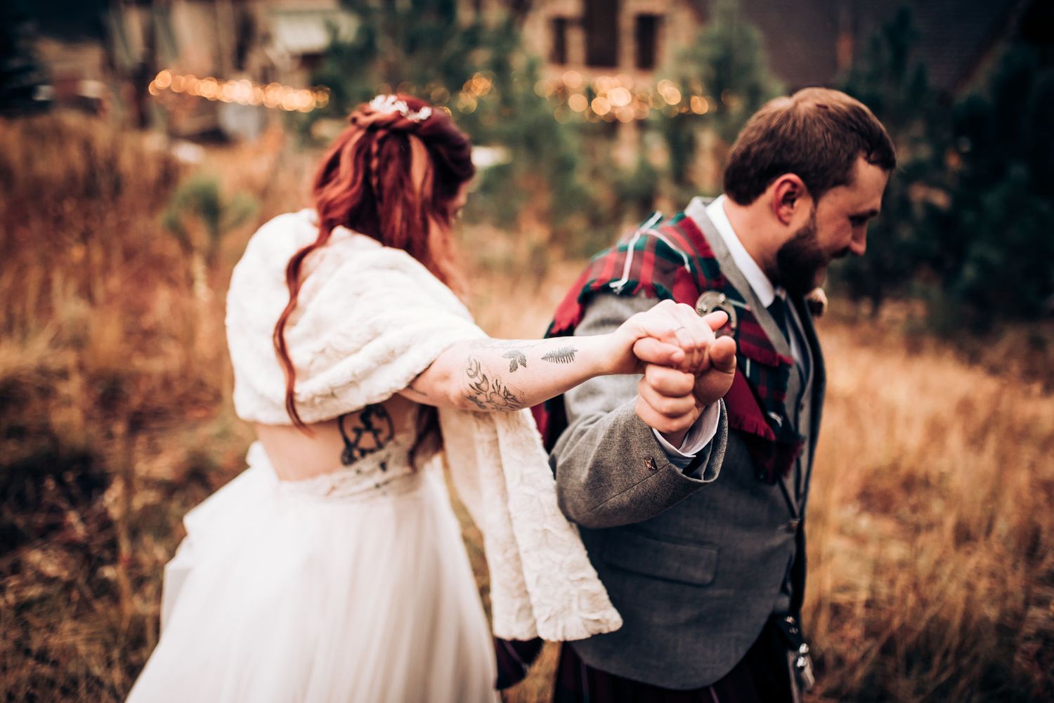 Wedding couple in winter attire sharing a romantic moment outdoors.
