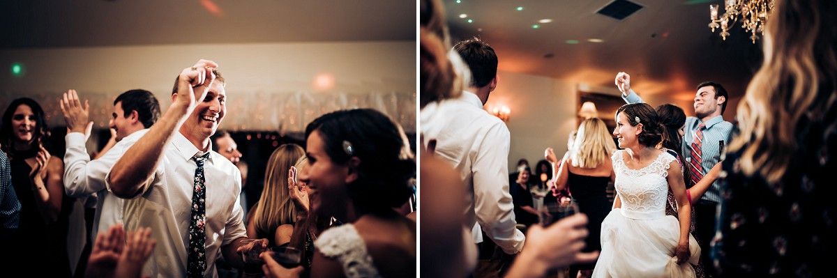 Wedding guests celebrate on the dance floor with enthusiasm and joy.