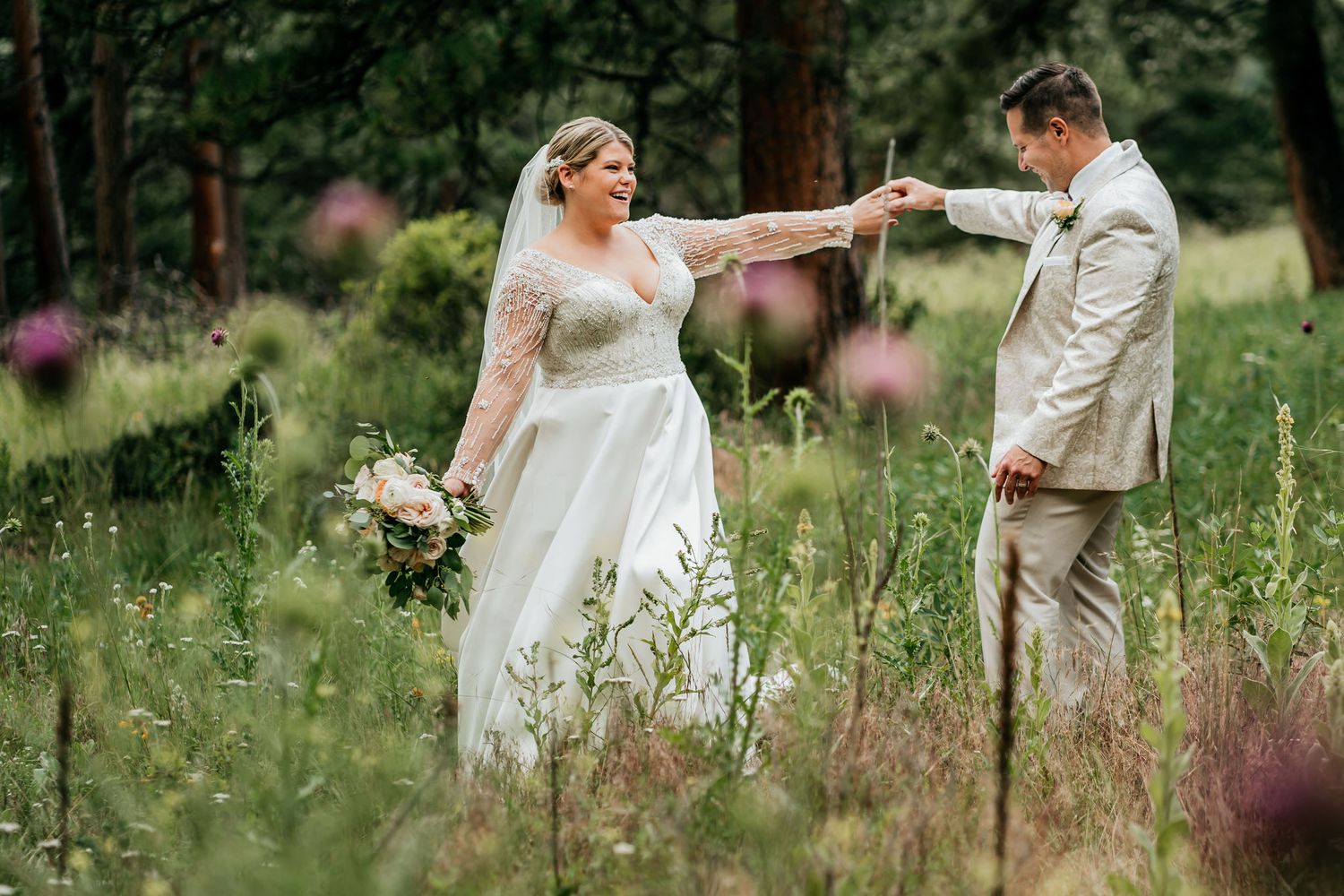 Couple sharing a romantic moment in a wildflower meadow.