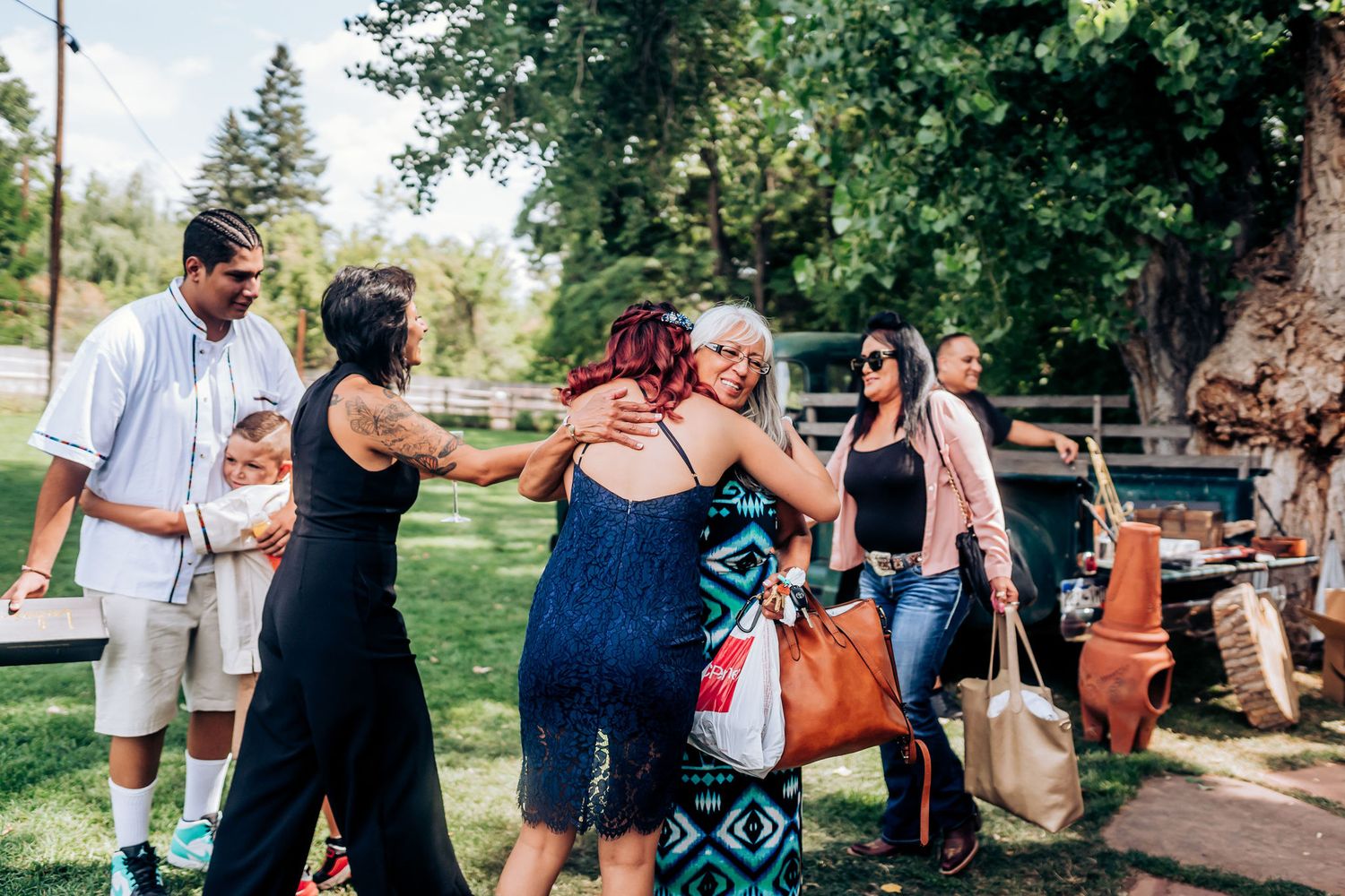 Group gathered outdoors during a summer celebration event.