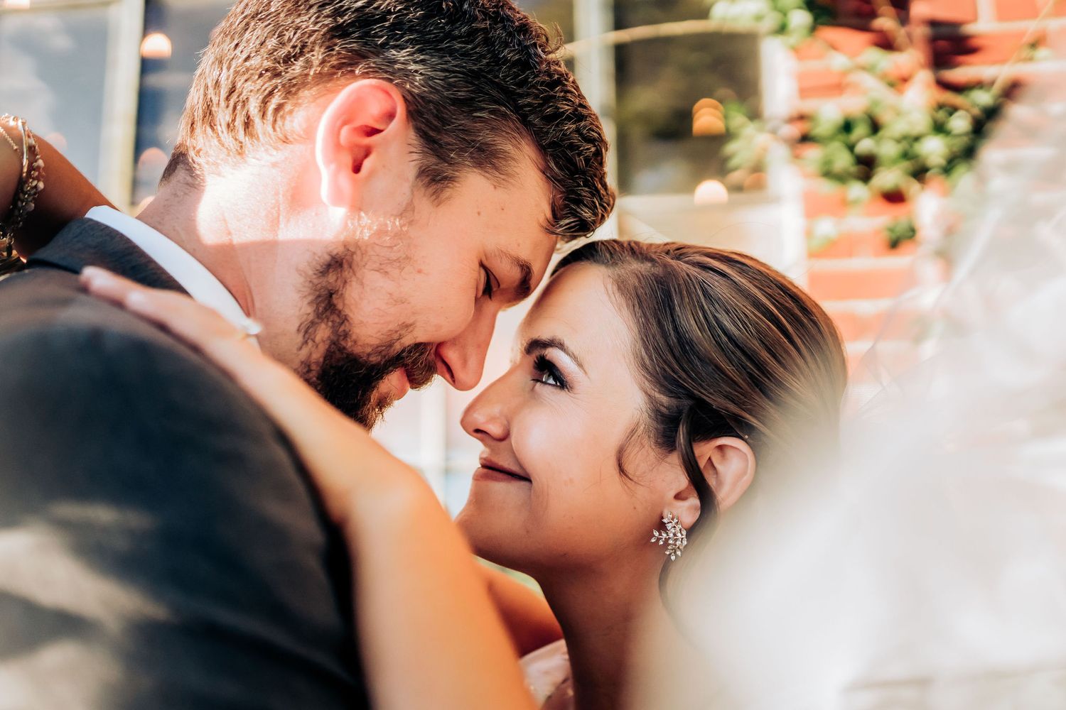 Tender moment between newlyweds as they embrace during their wedding photoshoot.