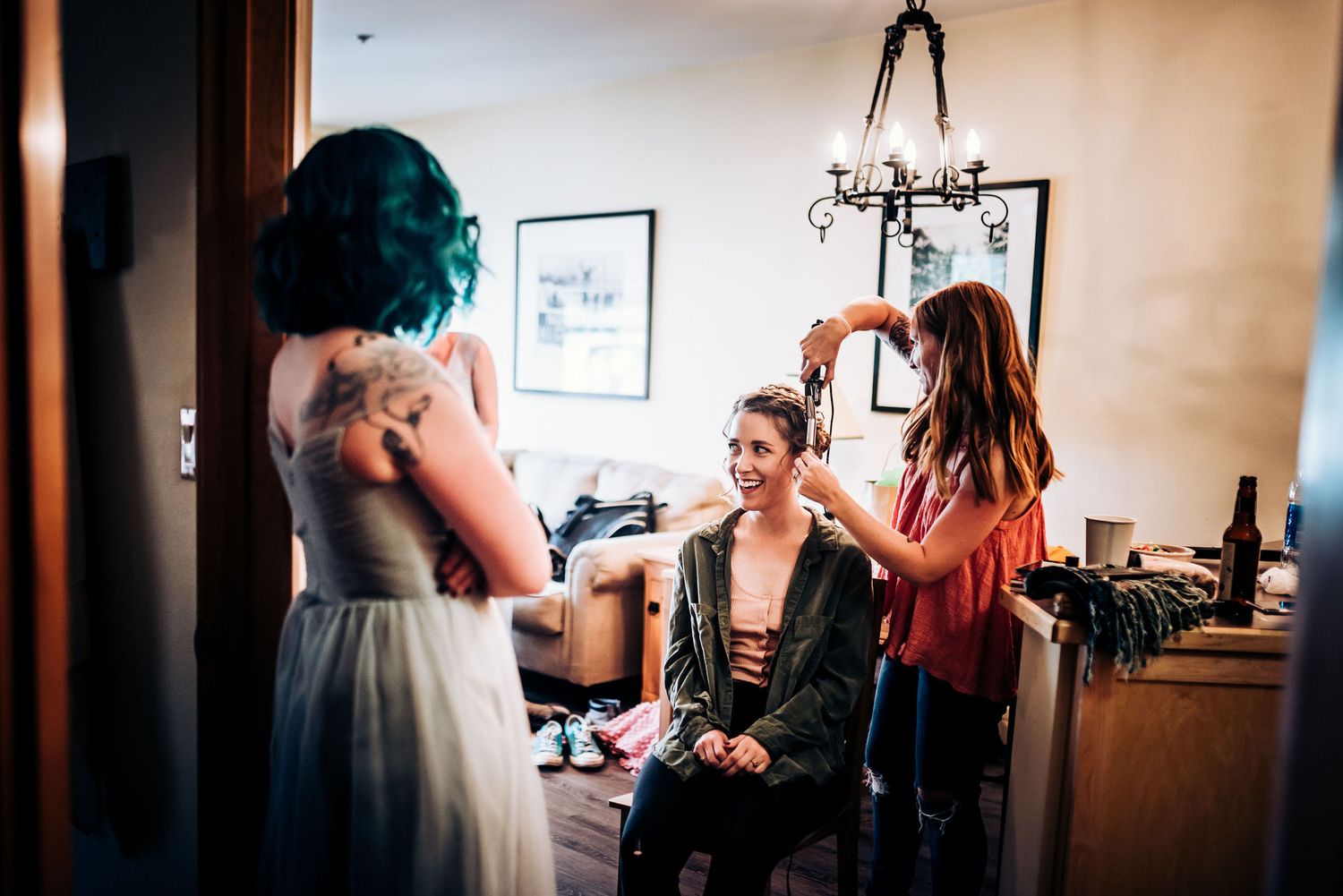 Wedding preparation scene with bridesmaids in a getting-ready room.