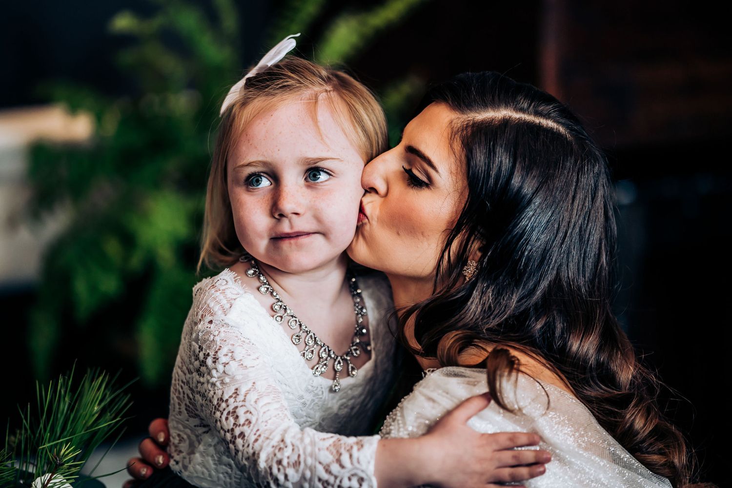 Sweet moment captured between two people in an intimate indoor setting.