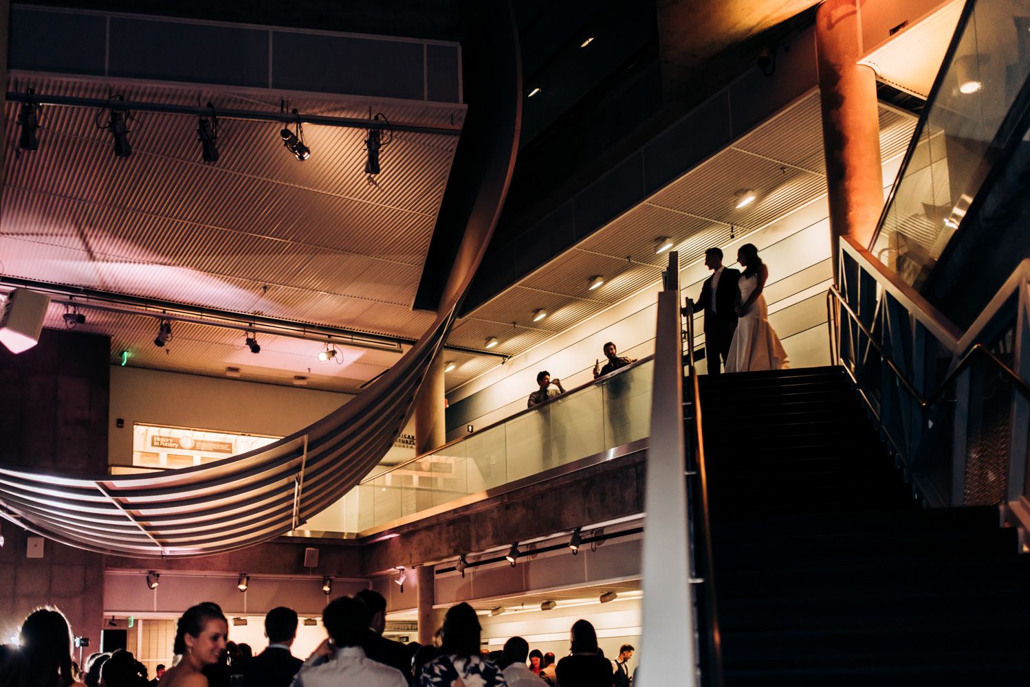 Modern event venue with tiered balconies and dramatic architectural lighting.