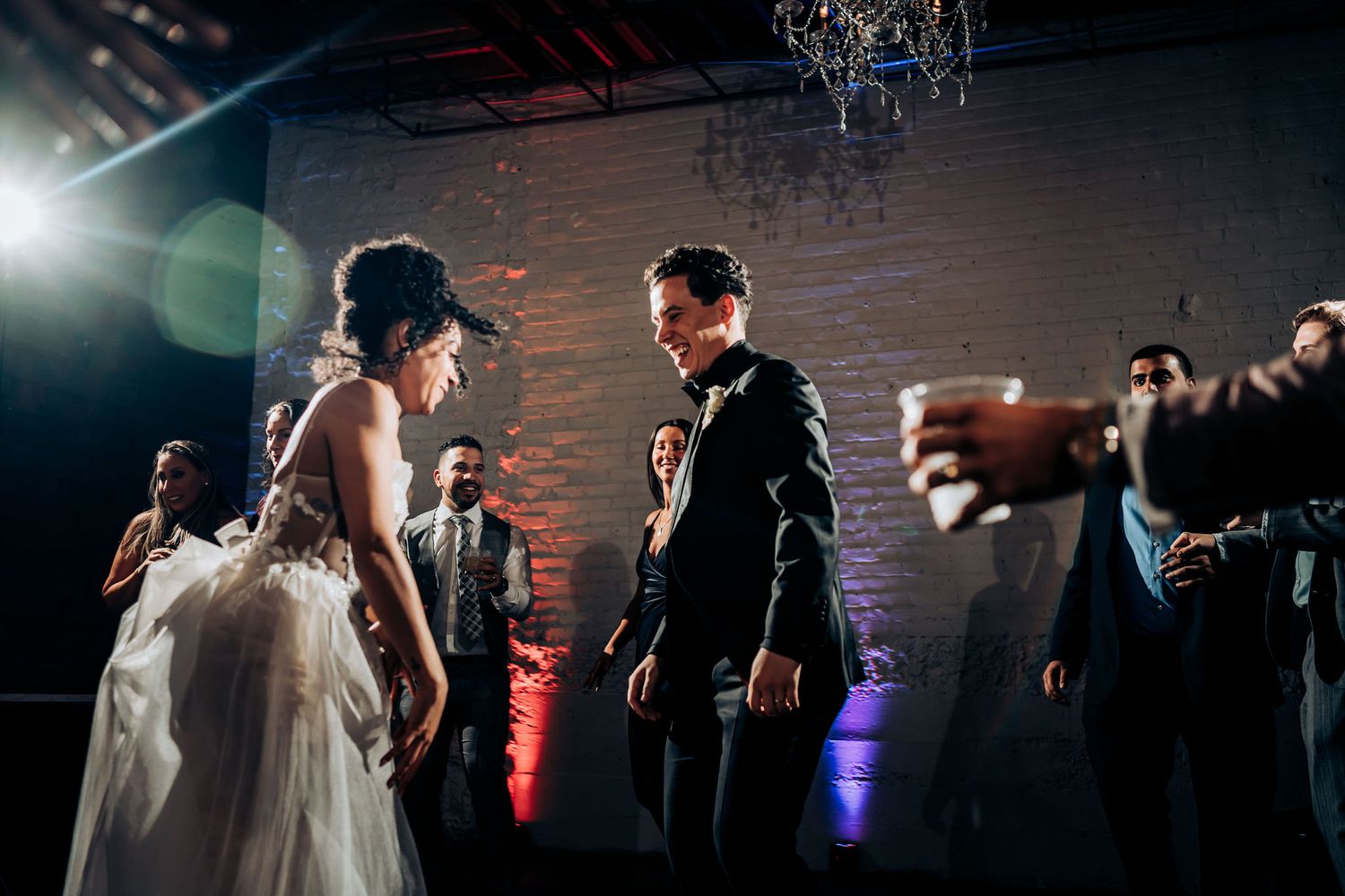 Couple shares an intimate moment on the dance floor during their wedding reception.