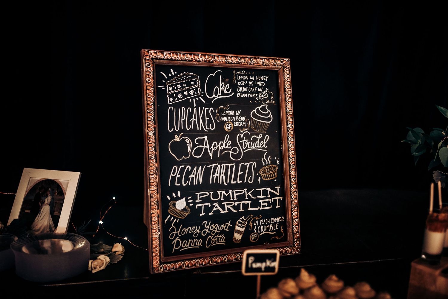Vintage-framed chalkboard menu with handwritten text and decorative lettering.