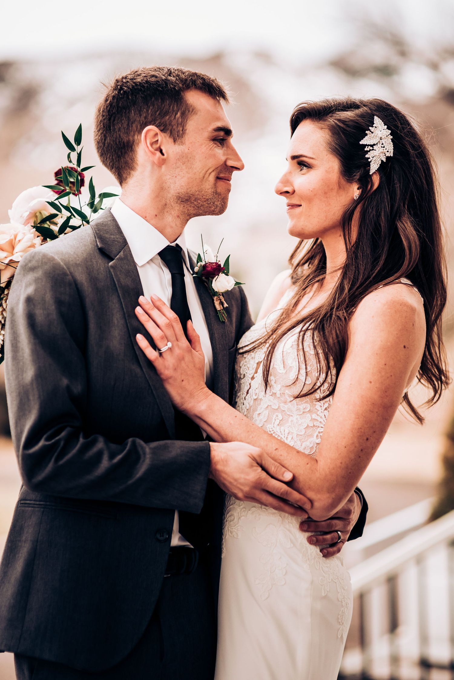 Intimate outdoor wedding portrait with soft natural lighting.