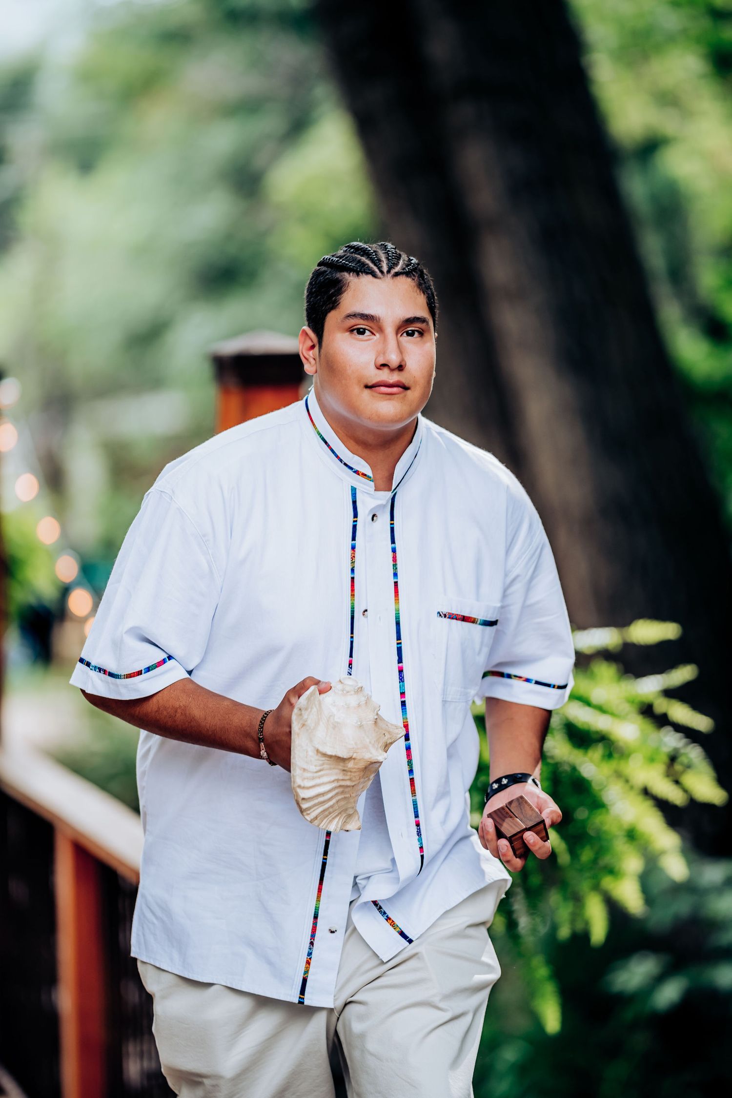 Person in white button-up shirt during outdoor celebration.