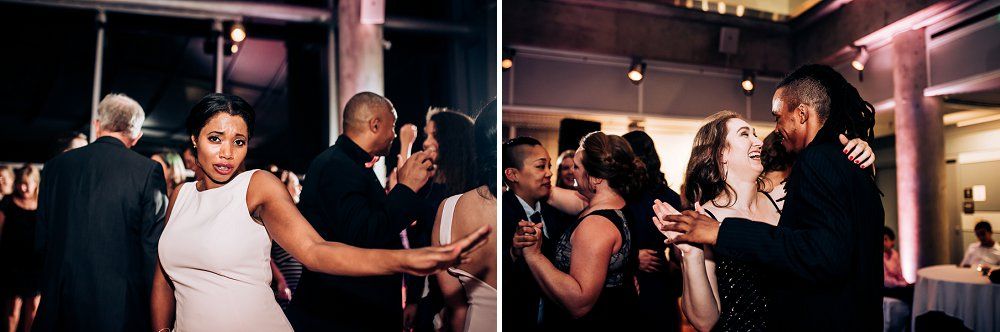 Wedding guests mingle and socialize during an indoor evening reception.