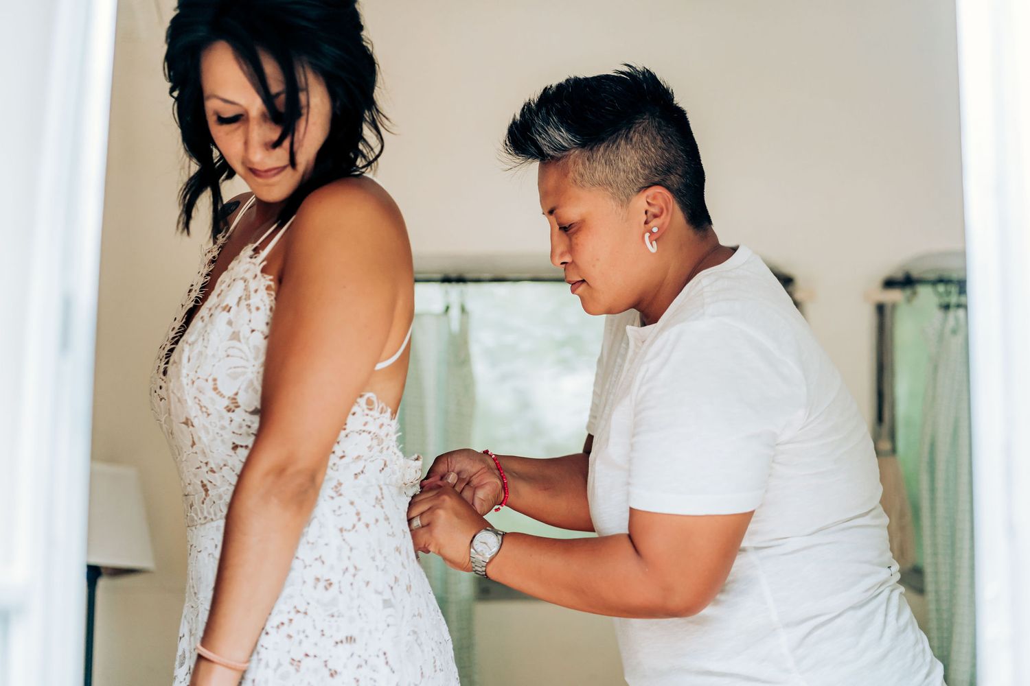 Intimate moment shared between two people in formal attire.