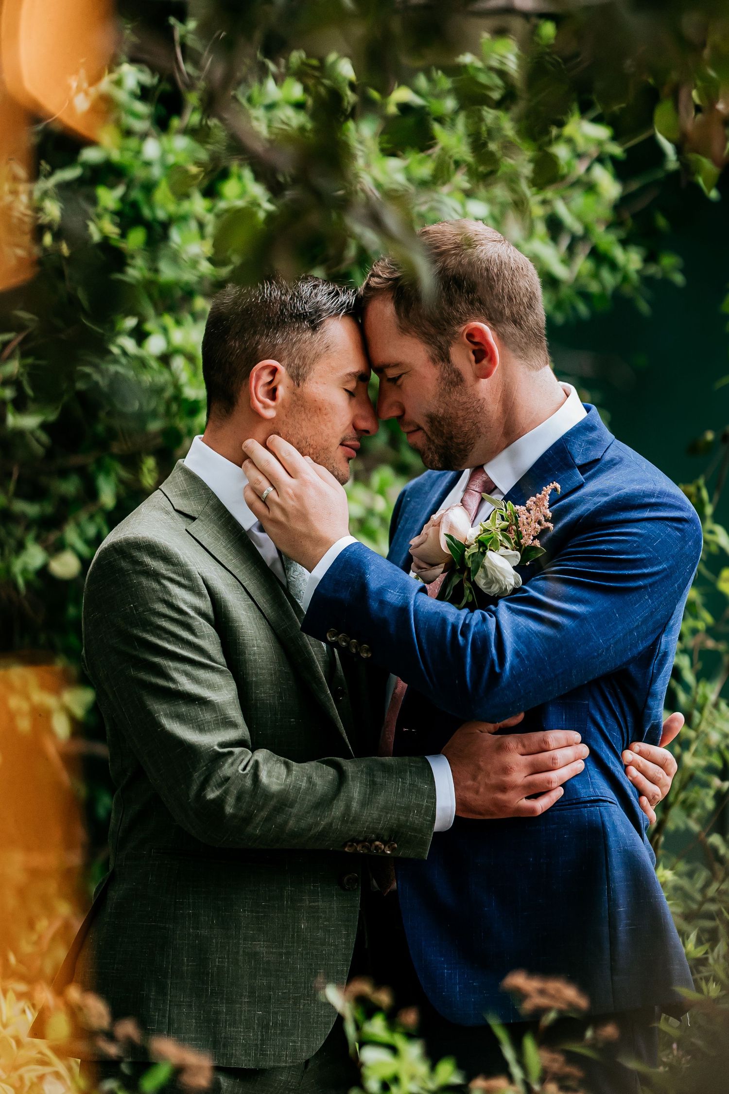 Two people share an intimate moment in formal attire during their wedding ceremony.