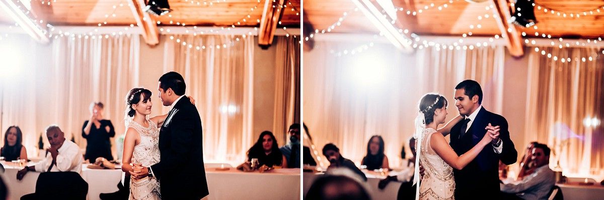 Romantic dance moment captured at wedding reception with string lights overhead.