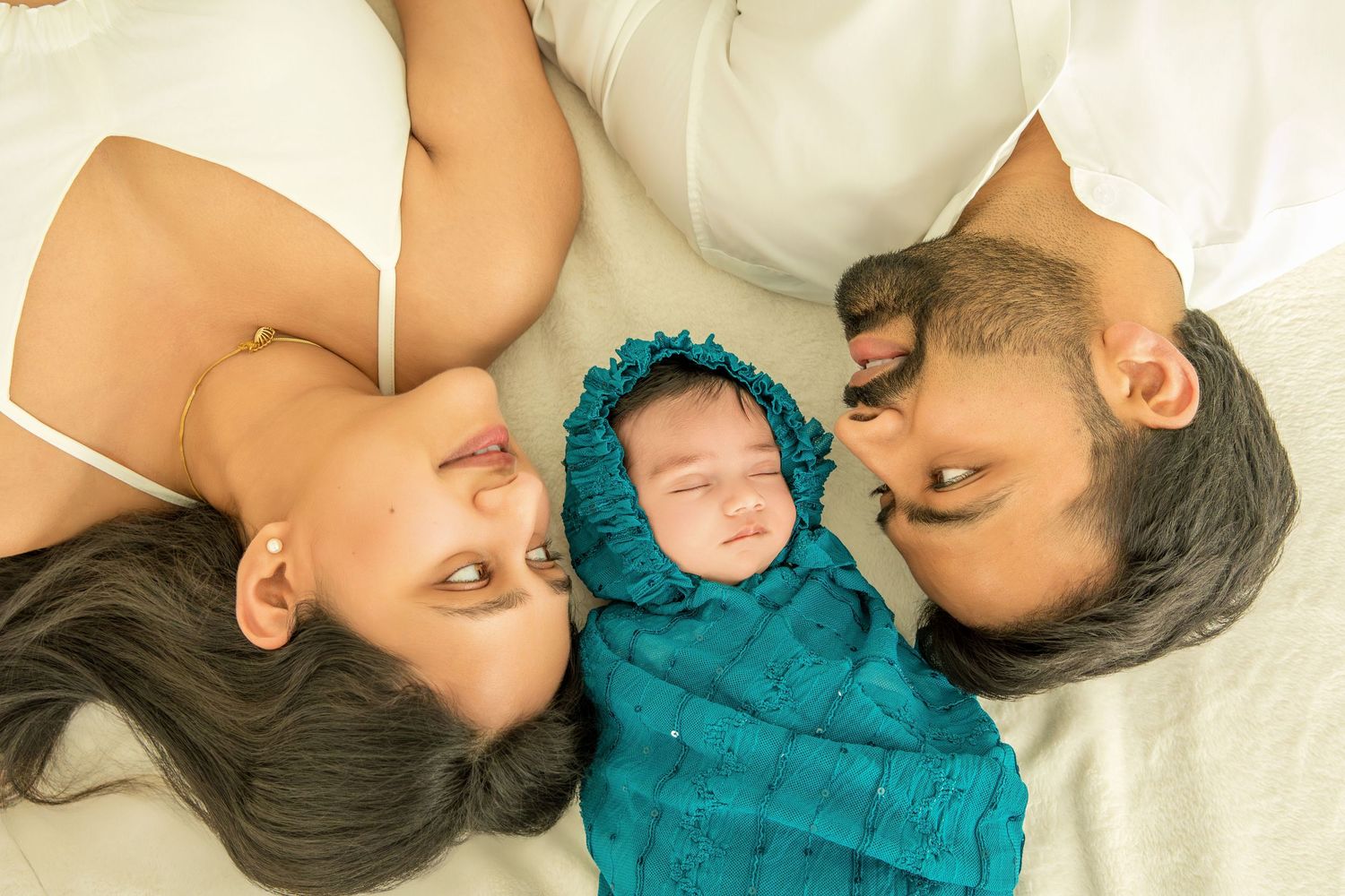 A series of intimate close-up photos showing tender moments between parent and child in soft lighting.