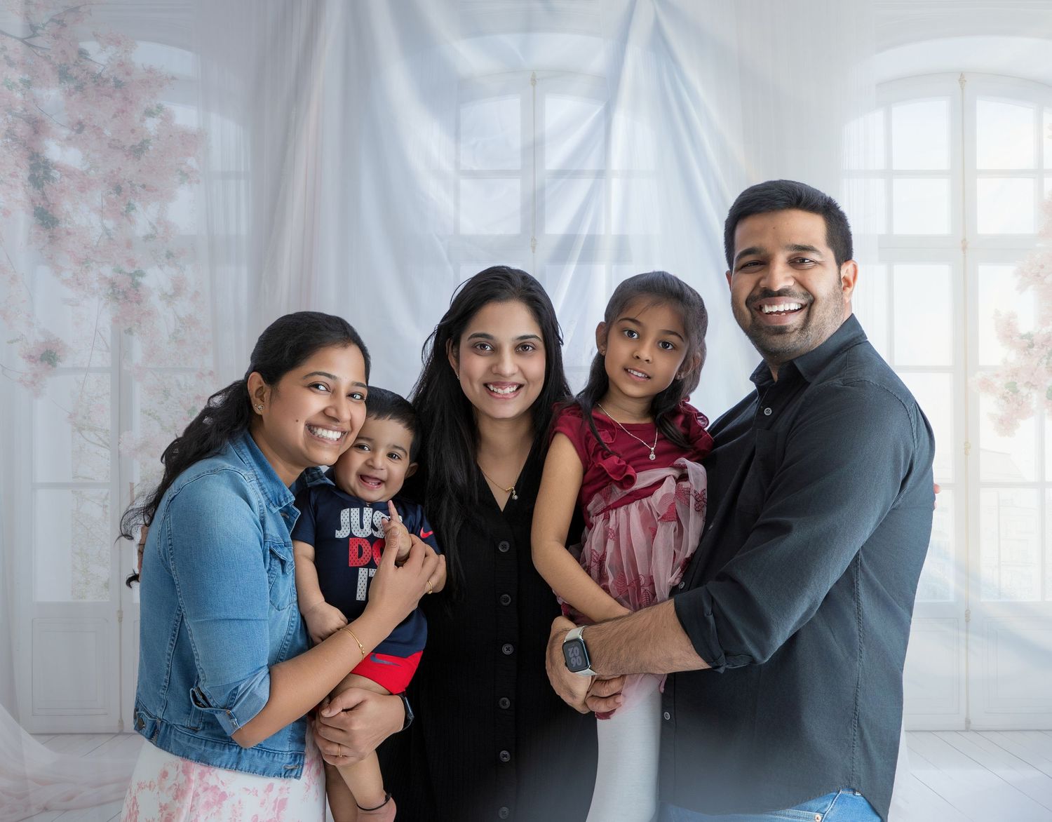 A happy family poses together in a series of candid shots showing joyful expressions and warm embraces.