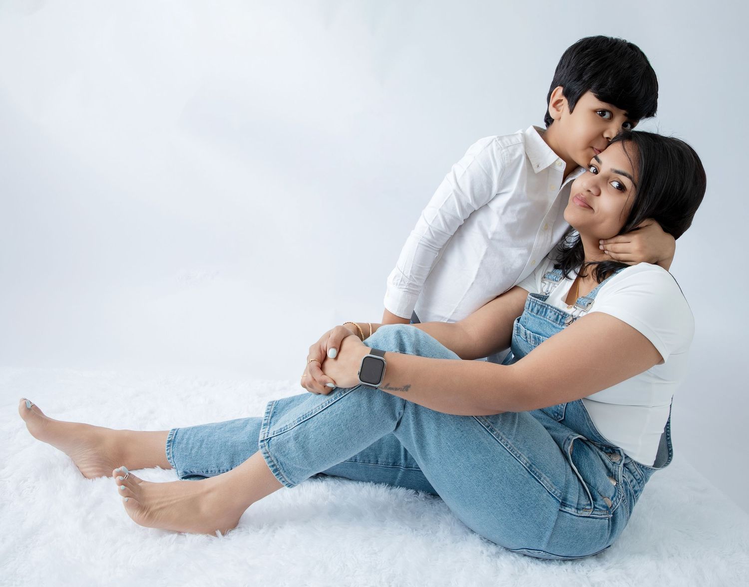 Artistic family photo sequence showing relaxed poses on white background.