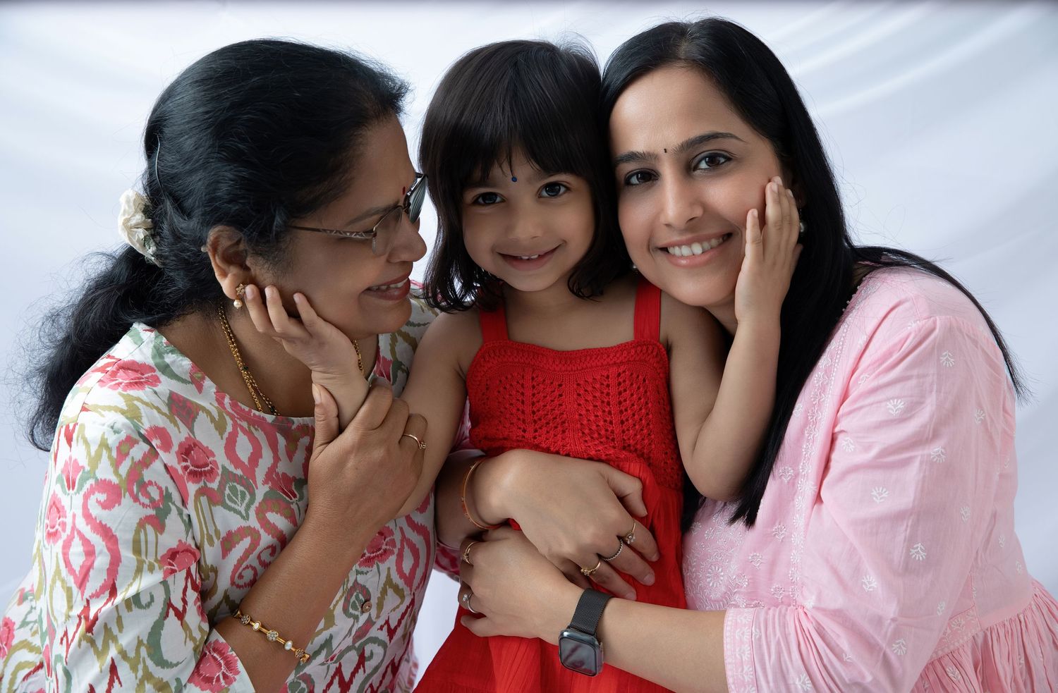 Family photo sequence showing loving interactions against white backdrop.