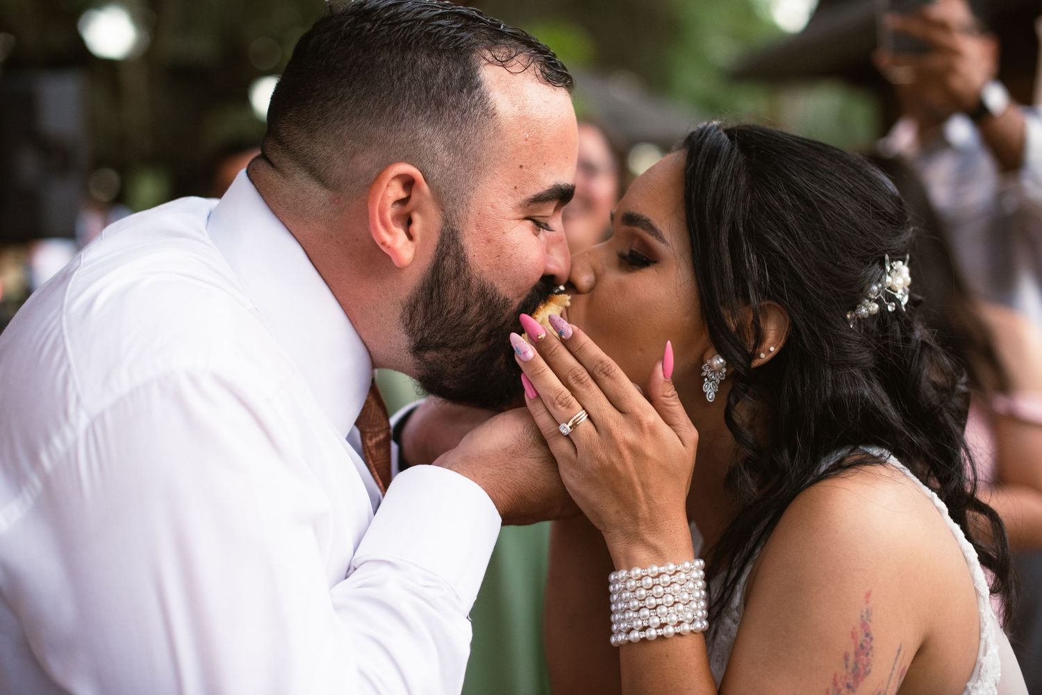 Intimate wedding moments captured in a sequence of romantic kisses.
