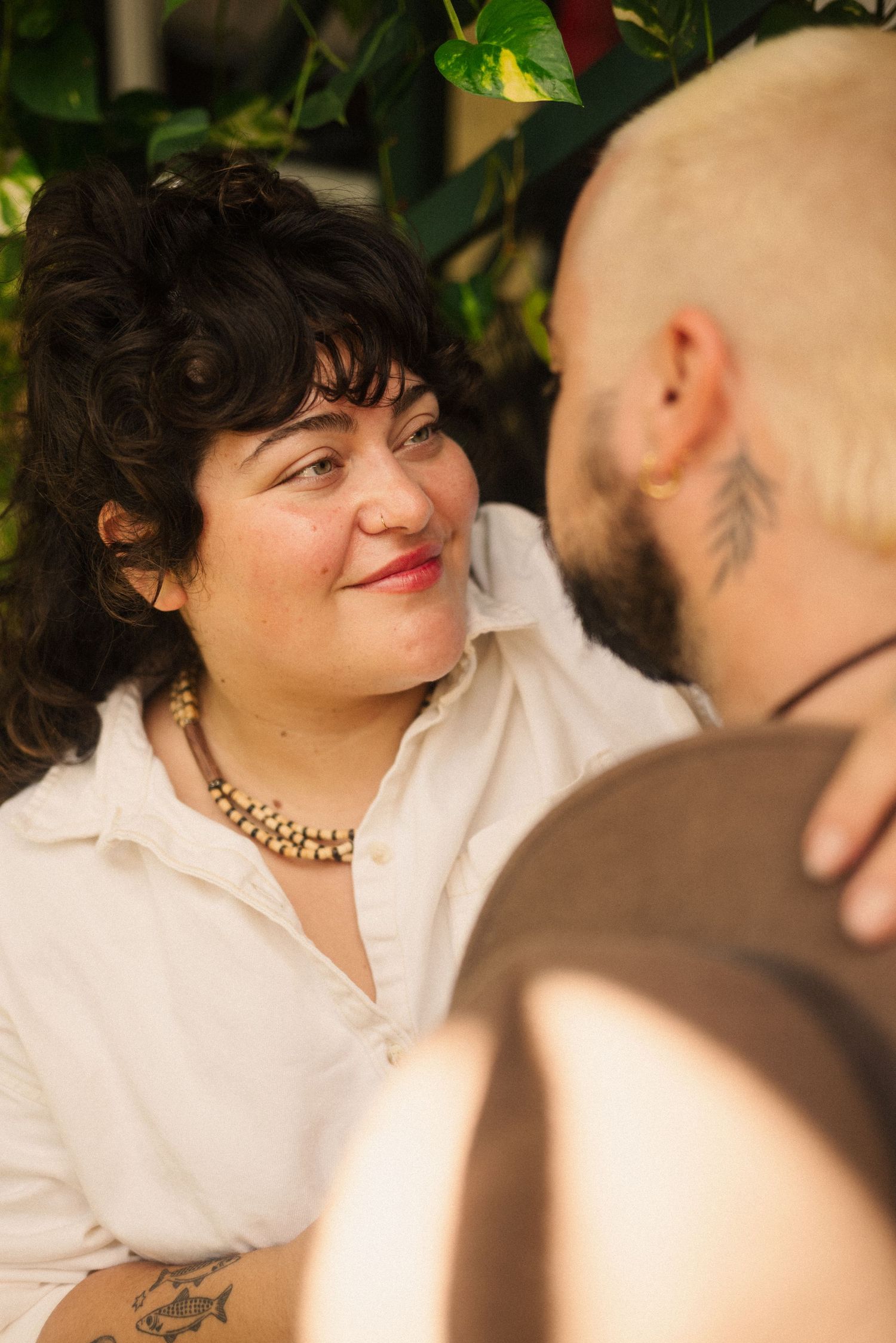 A romantic outdoor portrait session with natural foliage and soft lighting.
