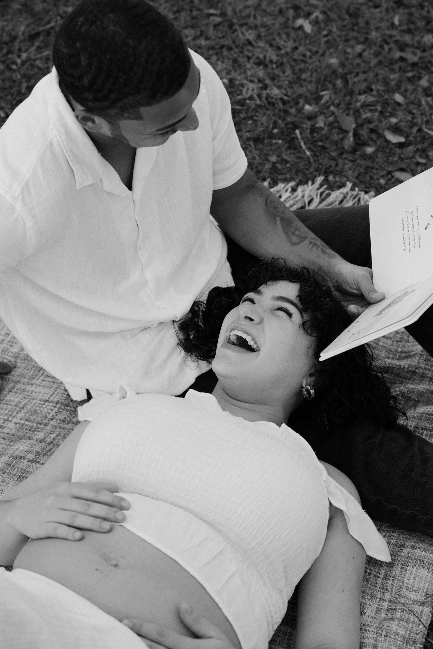 A black and white intimate portrait session captures tender moments between a couple.
