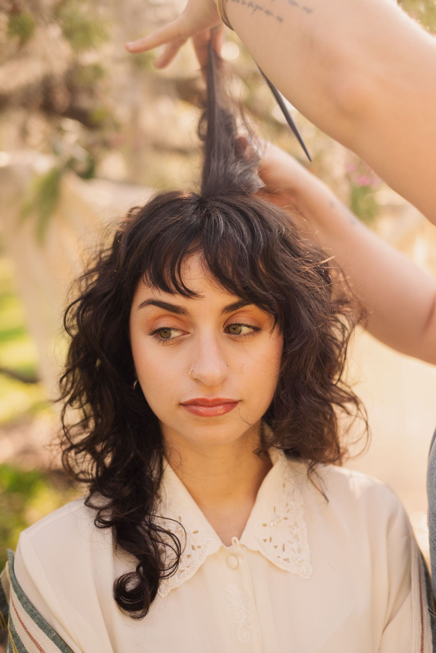 A portrait series showing curly dark hair and expressive features against a soft natural background.