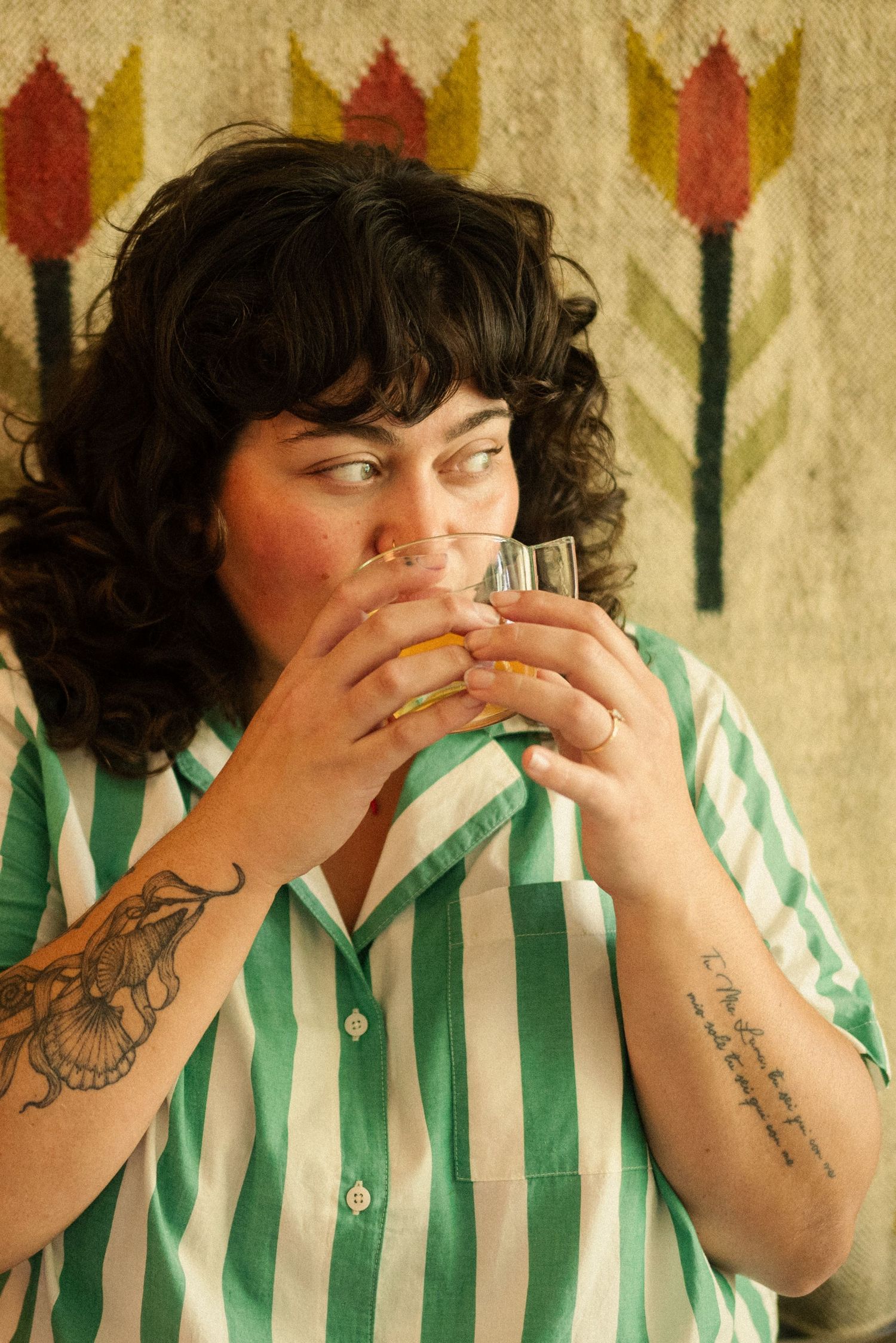 Person in green and white striped shirt showing playful expressions in a photo series.