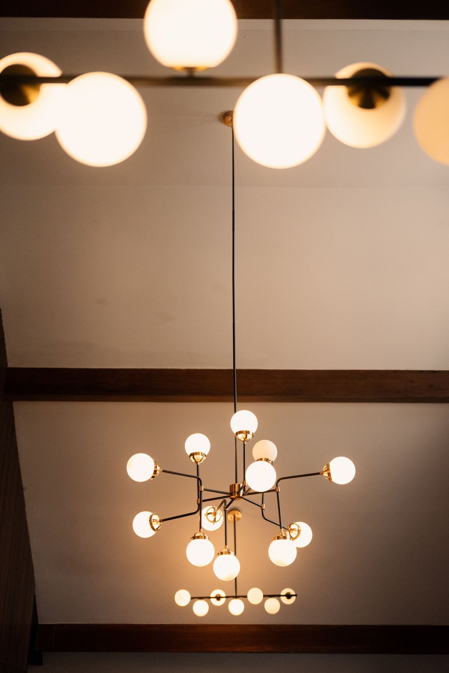 Modern light fixtures with globe bulbs illuminate a stylish interior space.