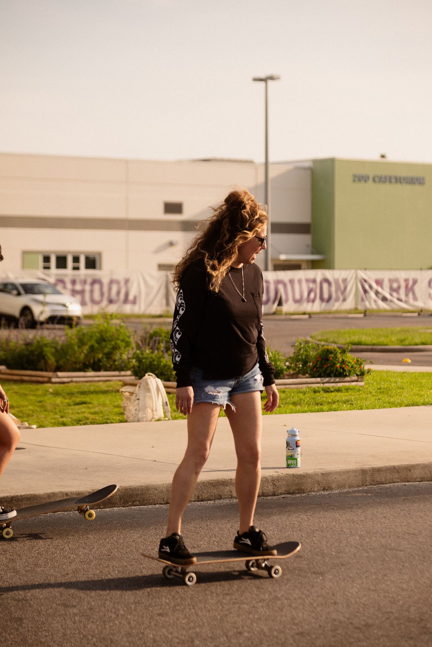 Skateboarding sequence showing low riding tricks in an urban setting.