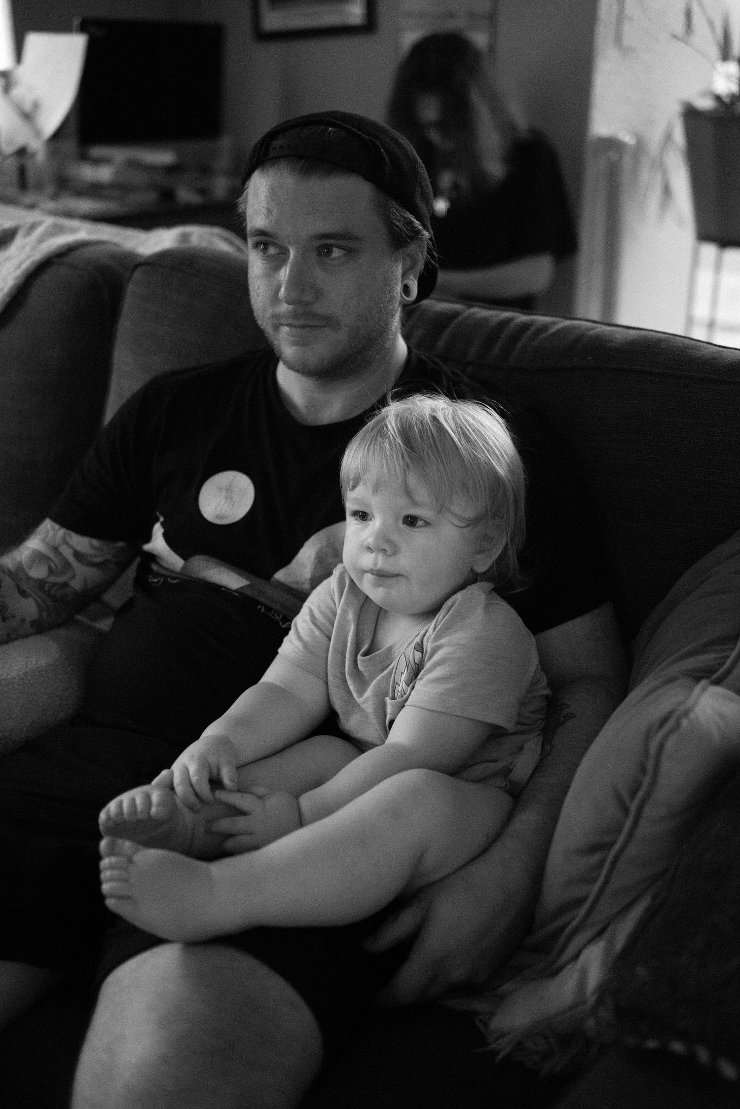 Black and white images of relaxed moments on a couch.